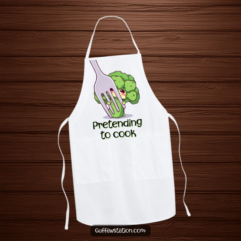 Funny apron with a shy broccoli floret character peeking from behind a giant fork, ideal for a gentle and fun cook.
