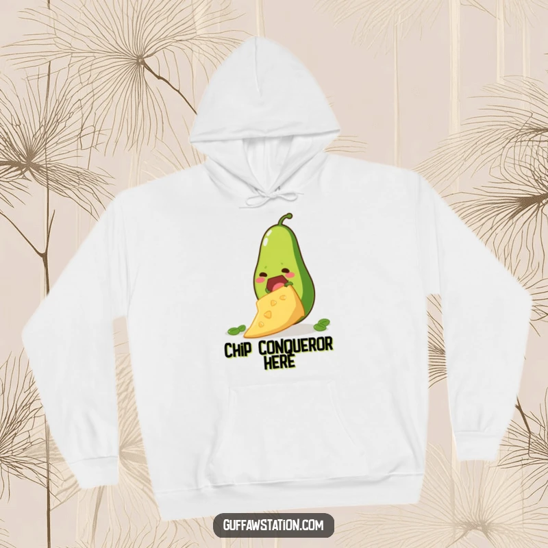 Funny hoodie showing a determined avocado climbing a giant tortilla chip, perfect for warm, ambitious, and humorous lounging.