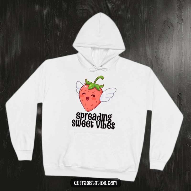 Funny hoodie featuring a delighted strawberry with tiny wings, looking eager to fly, perfect for comfort.