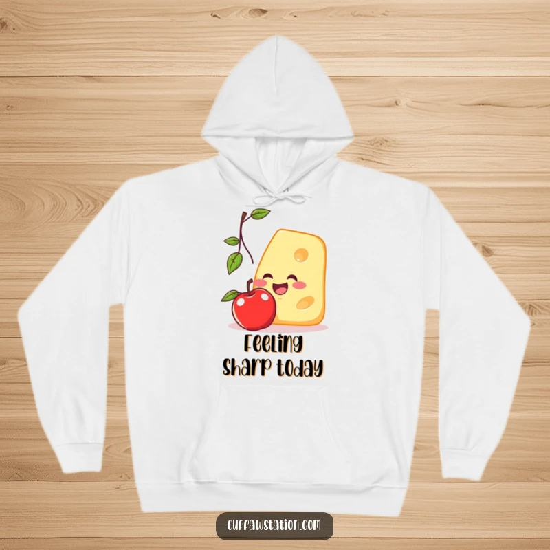 Funny hoodie depicting a determined cheese slice trying to catch a falling apple, radiating cartoonish charm and playful energy.