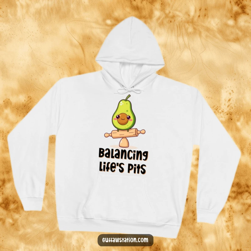Comfortable funny hoodie featuring a determined avocado balancing on a tiny rolling pin, embodying resilience and humor.