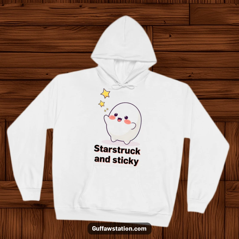 Funny playful blob character reaching for twinkling stars, a cozy and humorous hoodie for dreamers.