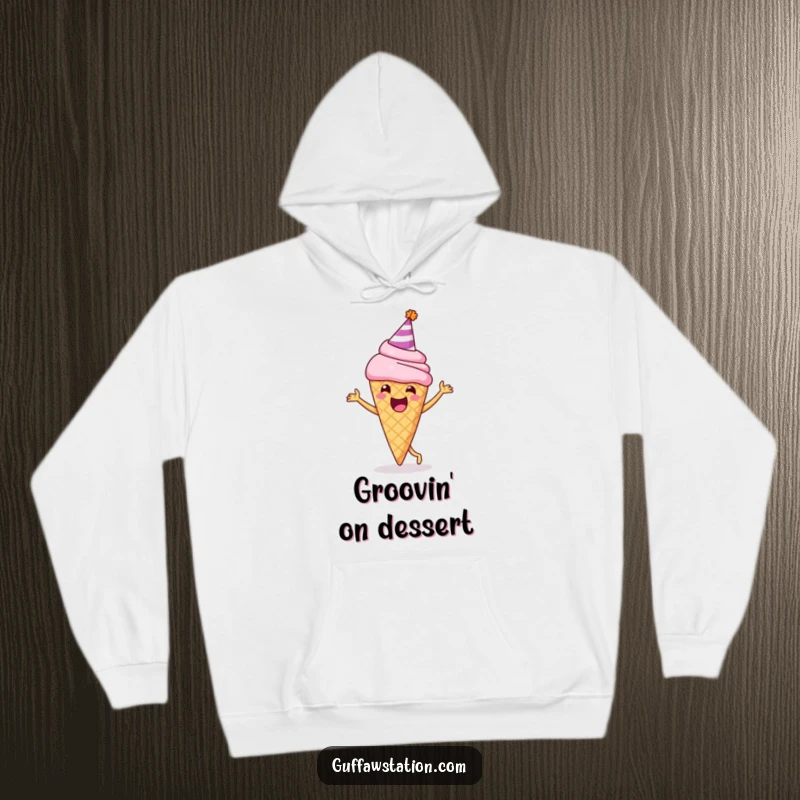 Funny hoodie depicting a delighted ice cream cone wearing a party hat, joyfully doing a happy dance, offering warmth and cheer.