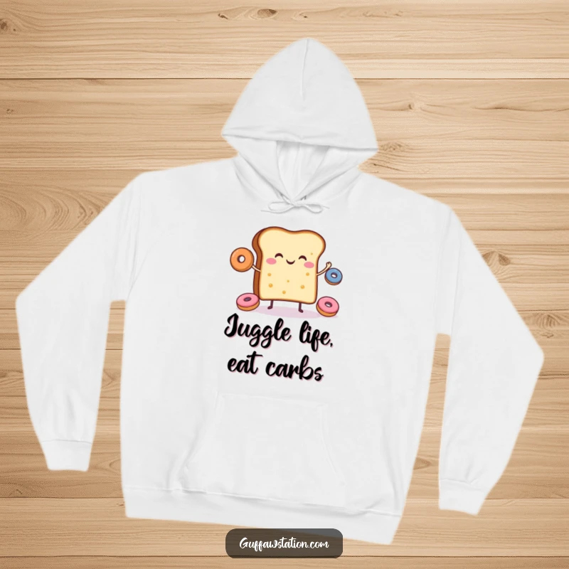 Funny hoodie featuring a cheerful slice of toast joyfully juggling donuts, perfect for cozy days.