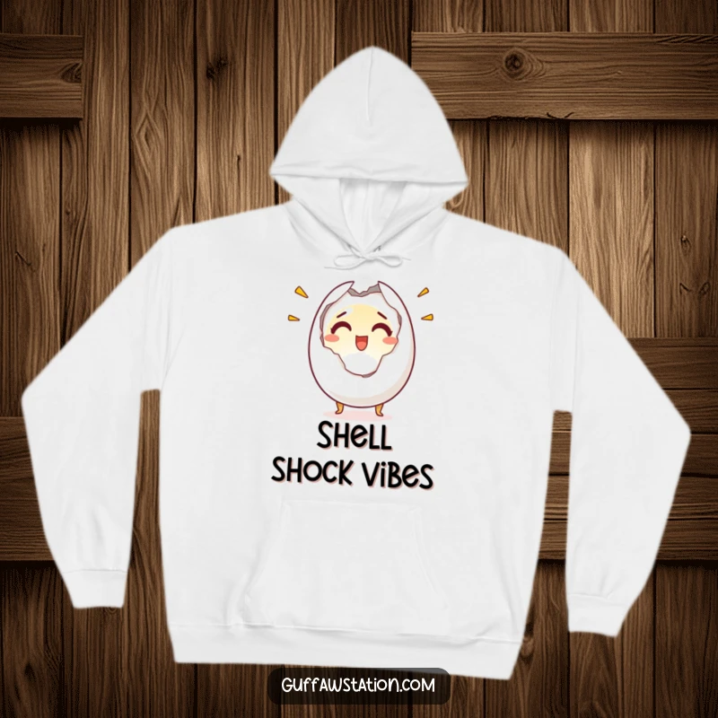 Funny hoodie featuring a startled egg character cracking in half with a surprised and joyful look, perfect for cozy, humorous wear.