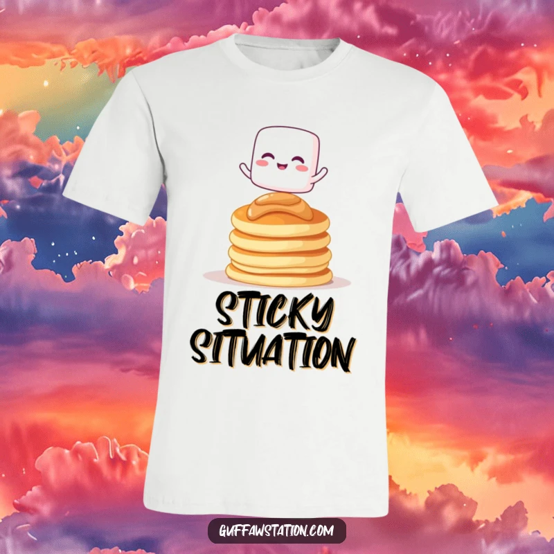 Funny t-shirt with a giggling marshmallow character balancing on pancakes, great for casual wear and breakfast lovers.