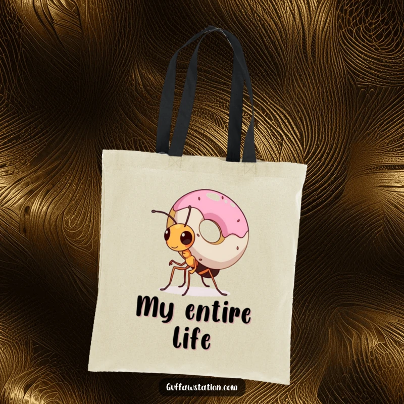 Funny tote bag showcasing a tiny, determined ant struggling but succeeding to carry a massive donut, highlighting incredible effort.