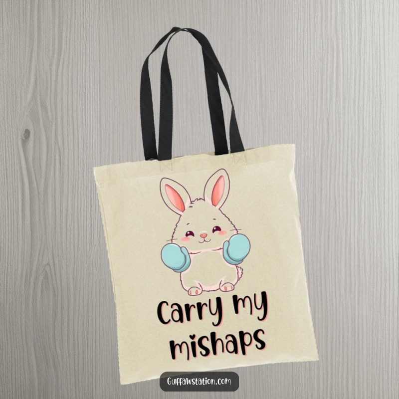 Funny tote bag showcasing a fluffy bunny accidentally wearing oven mitts as mittens, perfect for carrying groceries with a humorous touch.